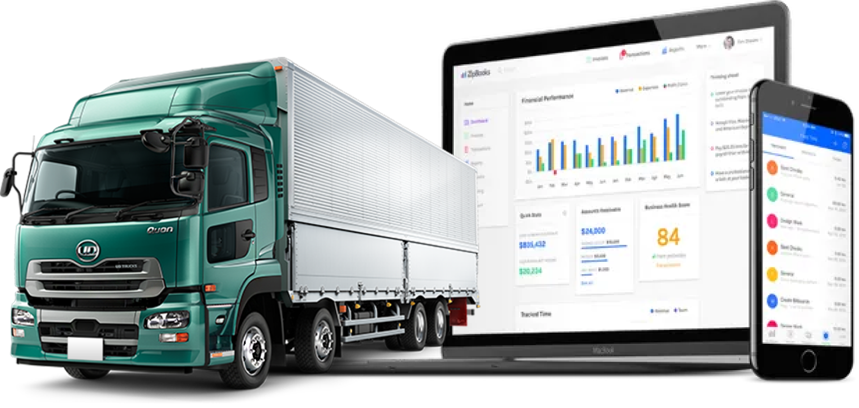 A truck parked next to a computer setup, featuring the vehicle's wheels and structure prominently displayed.