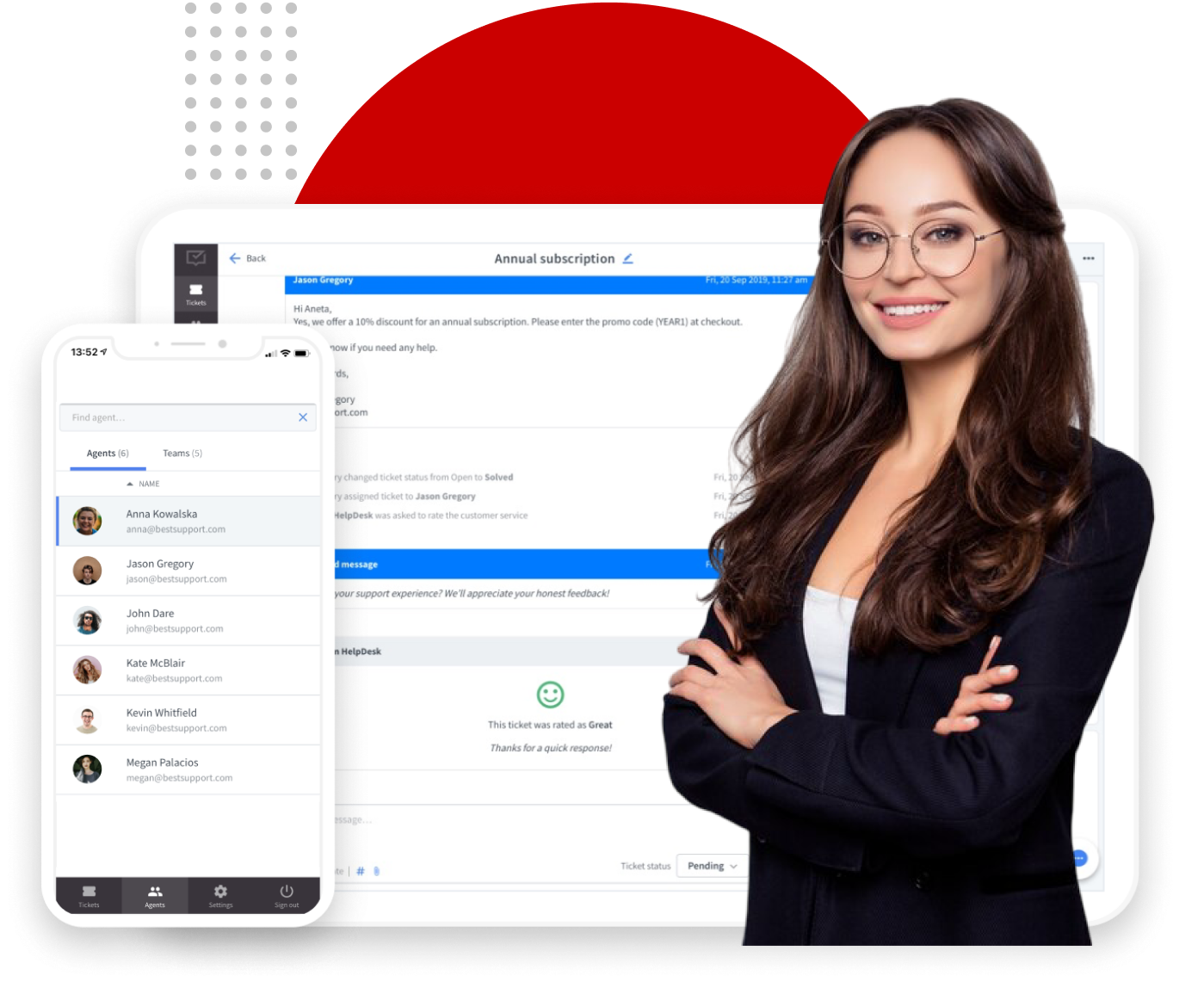 A smiling woman standing next to a cell phone with text visible on the screen, dressed in casual clothing.